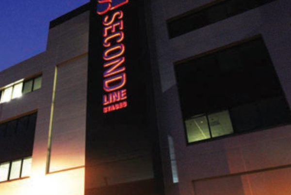The MBS Group Second Line Stages sign at night